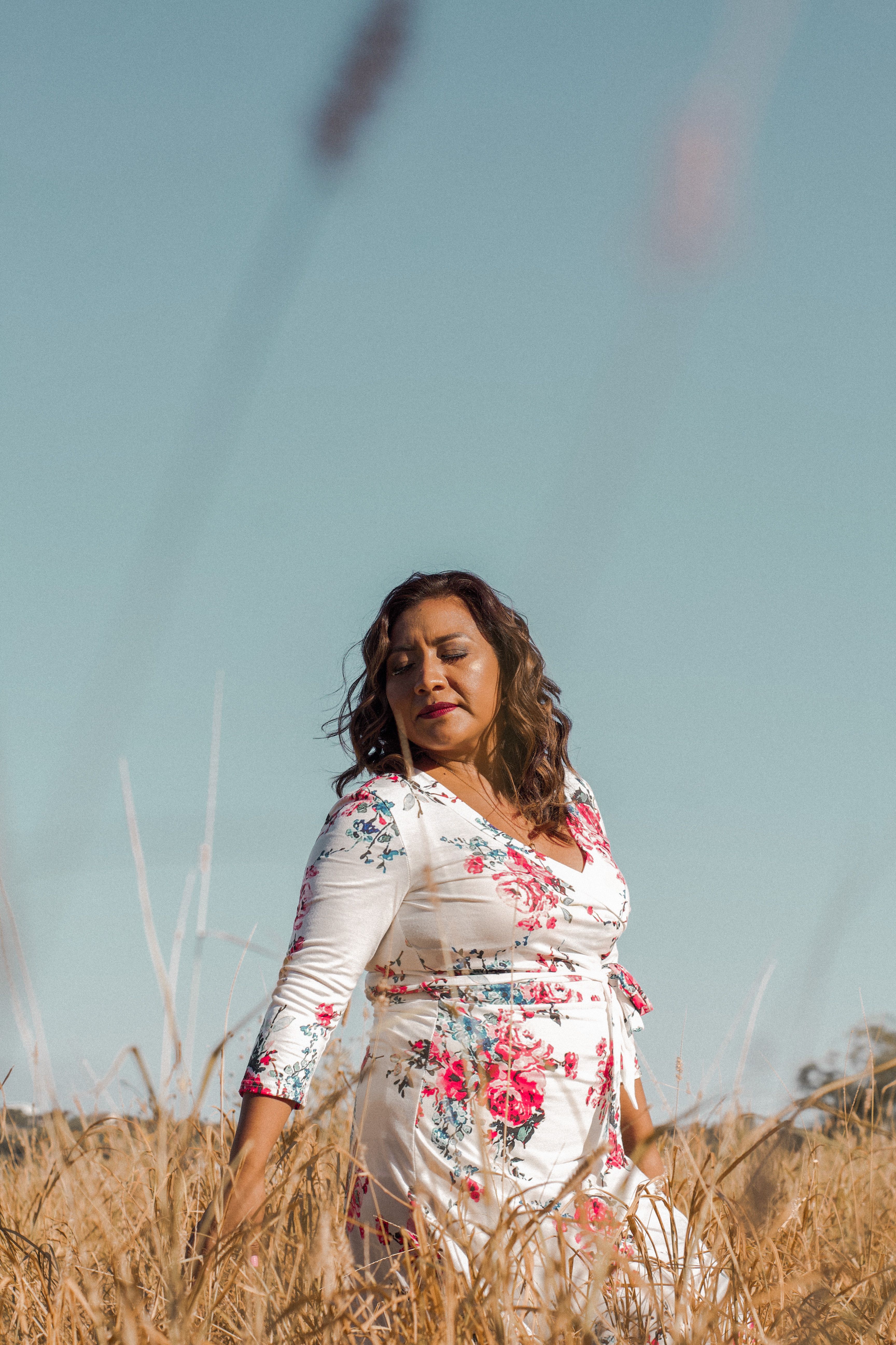 Woman In White Floral Long Sleeve Dress Standing On Brown Grass Field ...