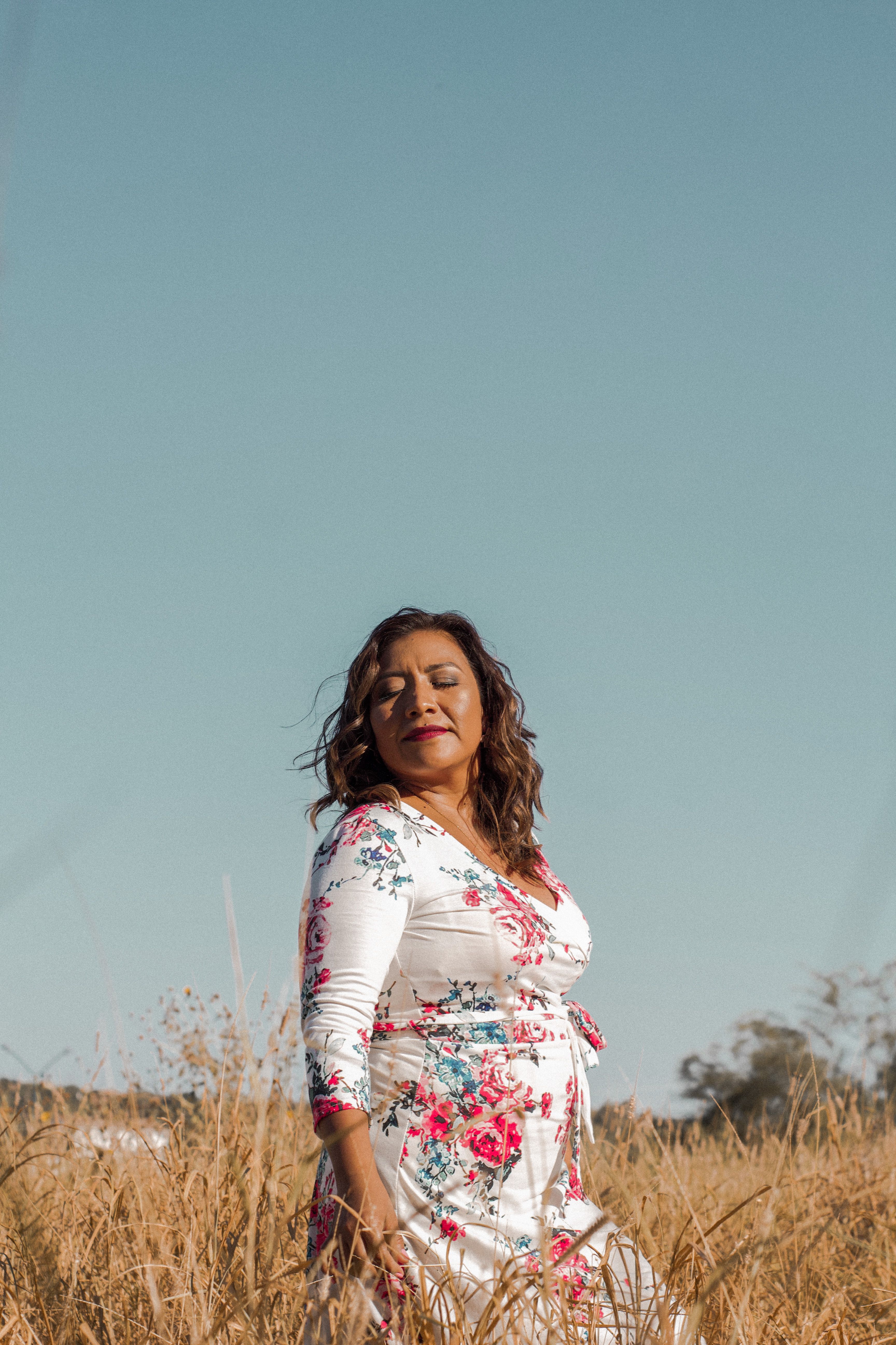 Woman In White Floral Long Sleeve Dress Standing On Brown Grass Field ...