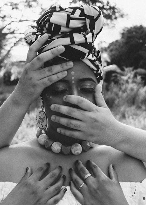 Grayscale Photo Of Woman's Face Covered With Hands