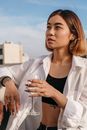 Woman in White Button Up Shirt Holding Clear Drinking Glass