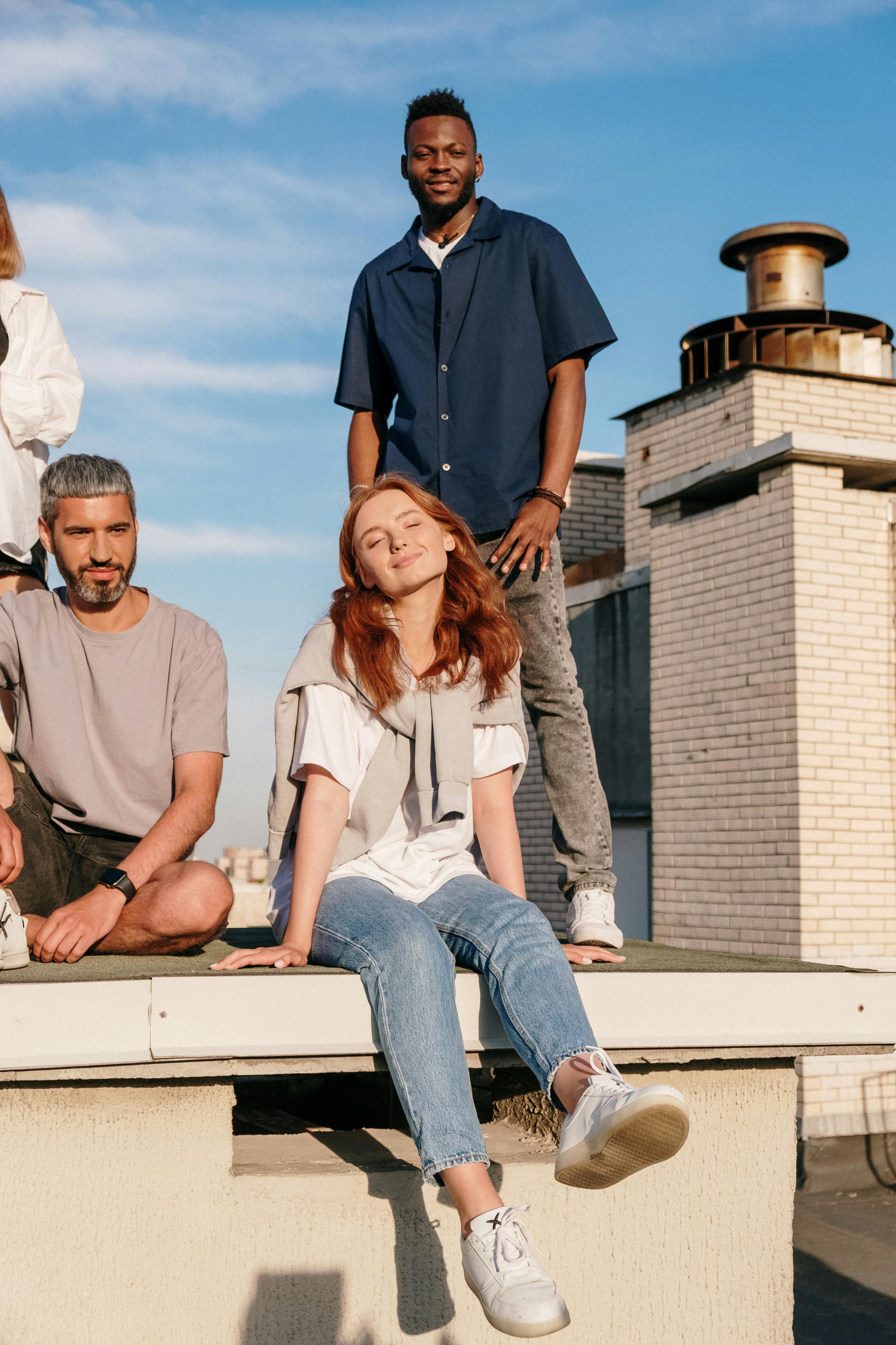 man in brown polo shirt sitting beside woman in white long sleeve shirt