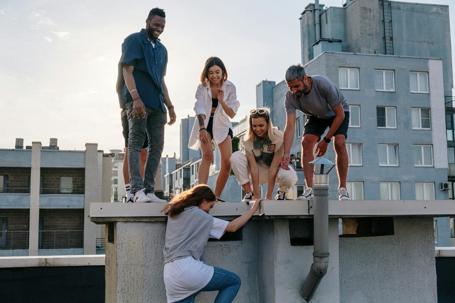 A group of friends enjoying a sunny day on a rooftop, symbolizing fun and friendship.