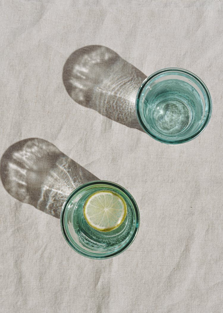 Clear Glasses With Water And Lemon