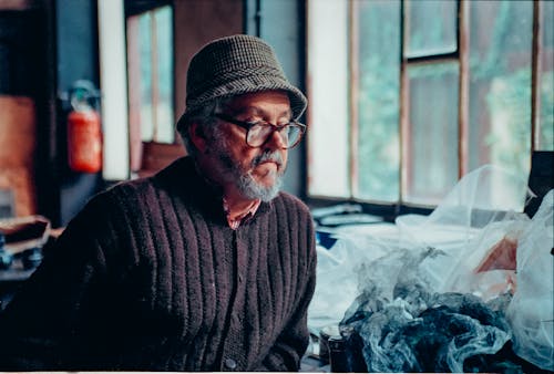 Elderly Man with Eyeglasses Wearing a Sweater