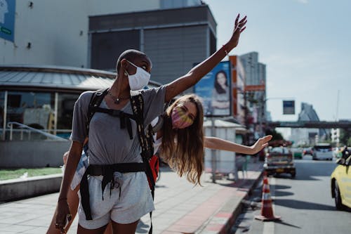 Photo of Tourists Waving Their Hands