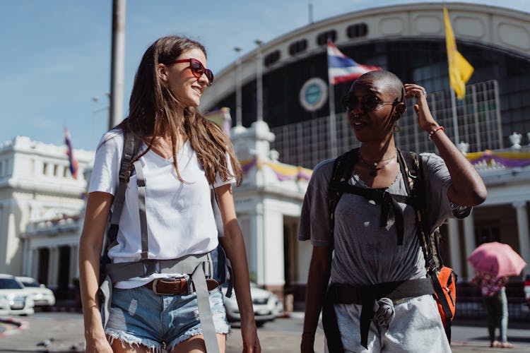 Two Women With Sunglasses Traveling Together