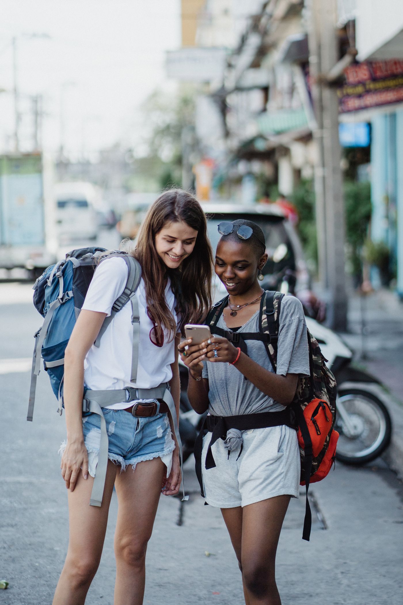 Traveler using a smartphone in a city