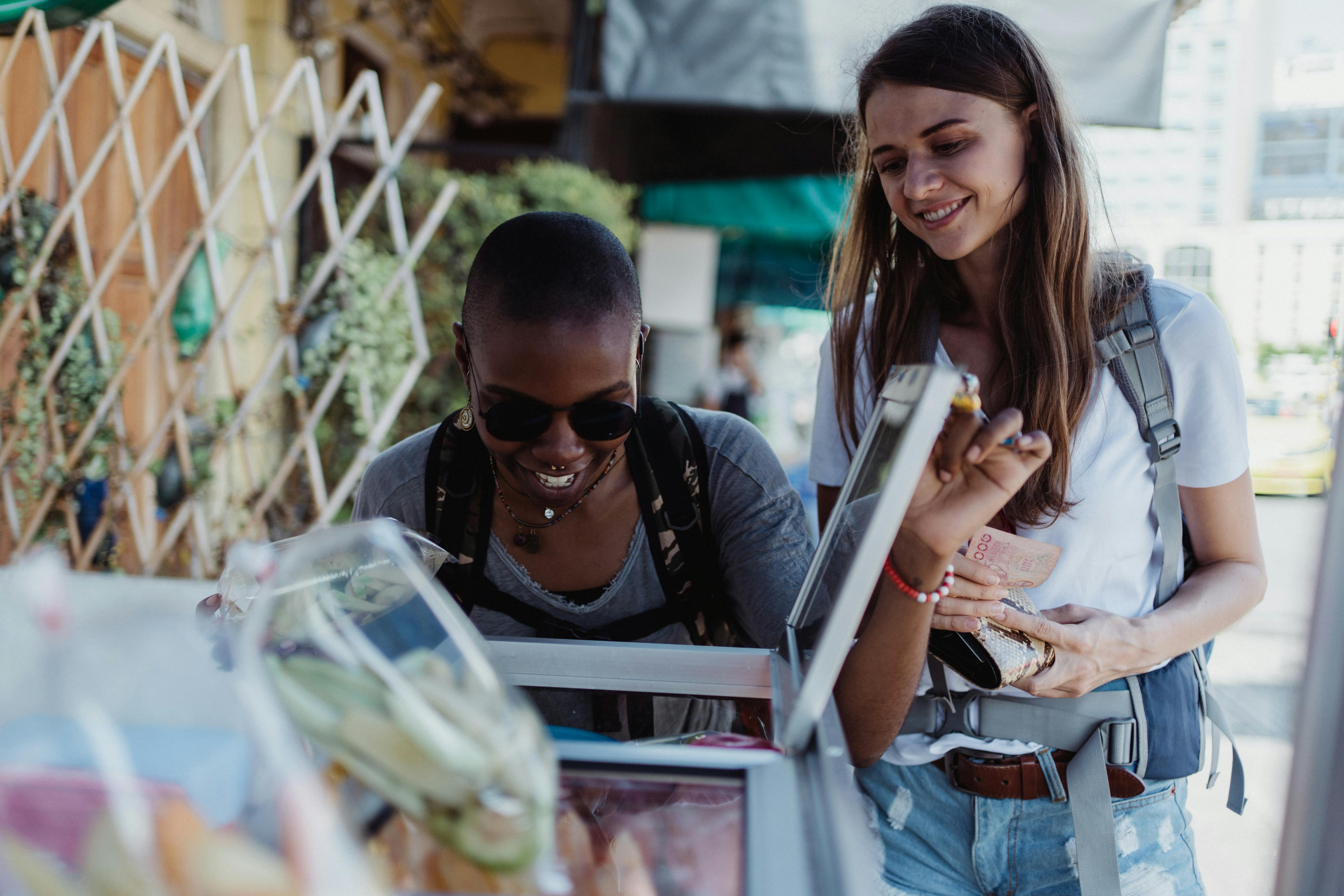 two women at a market stall