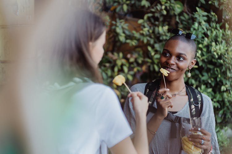 Women Enjoying Street Food Snacks