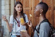 Tourists Having Snacks in City 