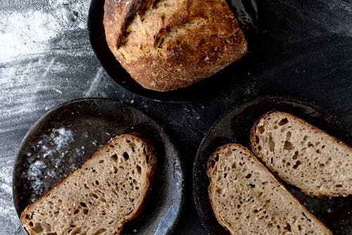 Slices of Sourdough Bread on a Black Ceramic Plate