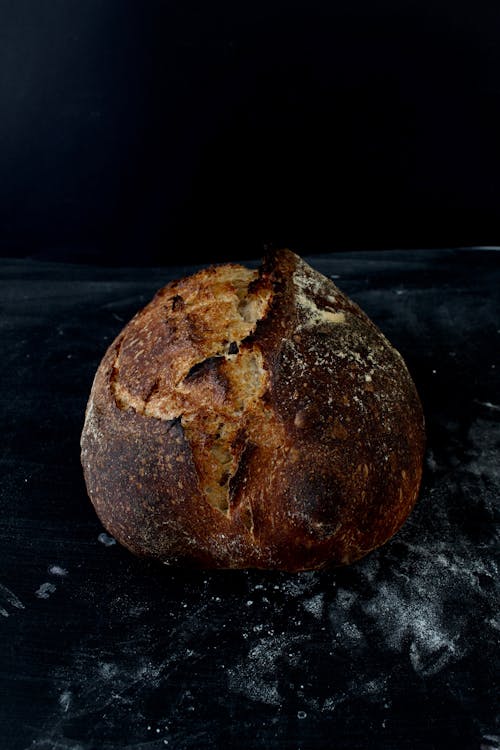 Freshly Baked Sourdough Bread on a Black Surface
