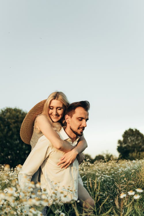 Woman Riding on Man's Back