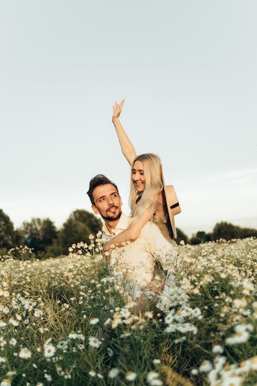 Woman Riding on Man's Back