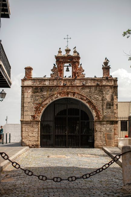 Exterior of folklore historic Catholic Chapel of Christ the Savior built in Baroque style in San Juan on clear summer day