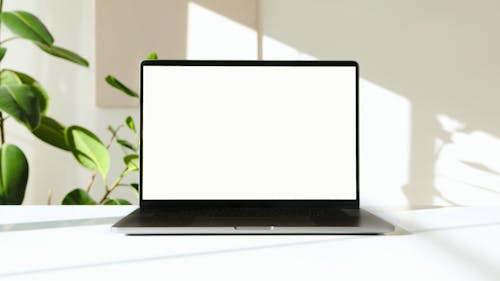 Free White Screen of a Laptop Stock Photo