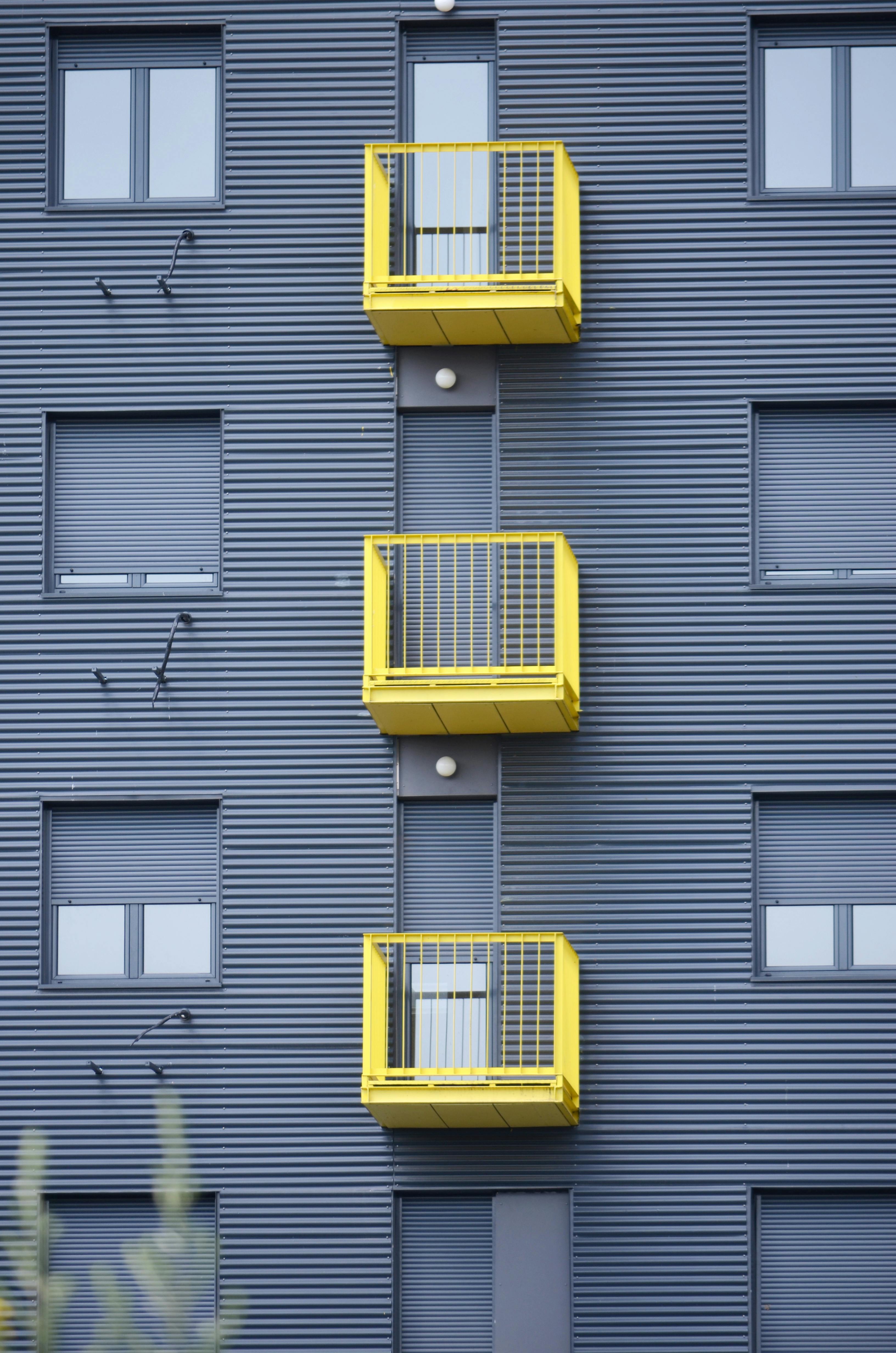 yellow balconies on building