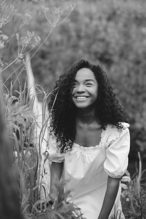 Woman in White Long Sleeve Shirt Smiling