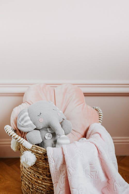 Free Plush Objects in a Woven Basket Stock Photo