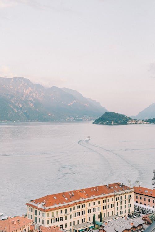 Aerial View of a Hotel and Lake Como with Mountains in the Background