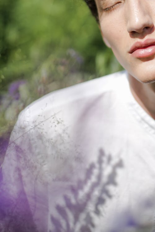 Woman in White and Purple Floral Shirt