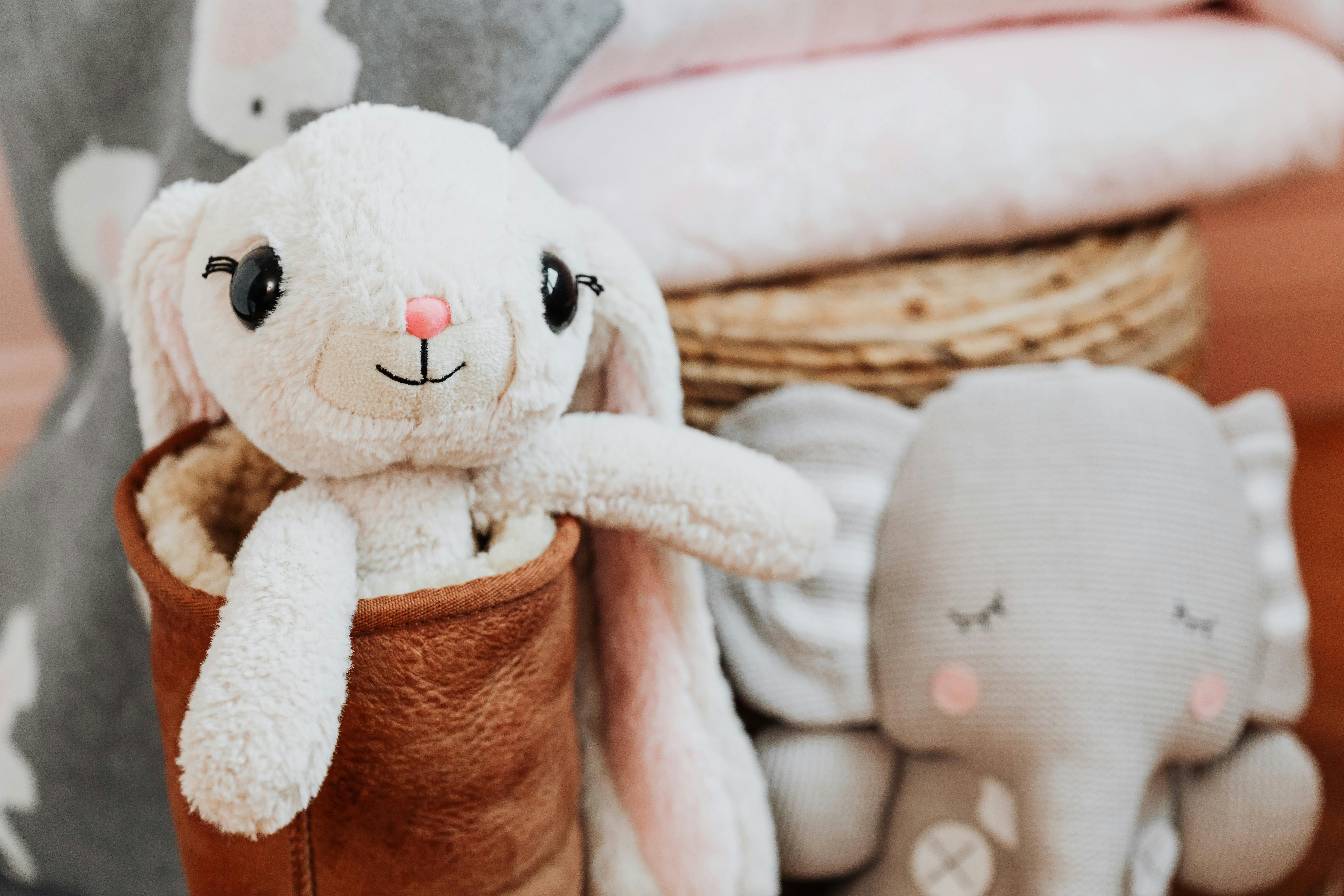 white and brown dog stuffed animal