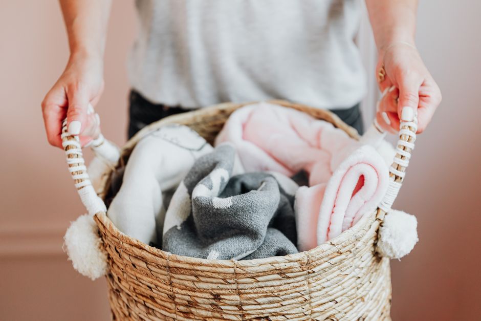 various folded baby blankets in a nursery various folded baby blankets in a nursery