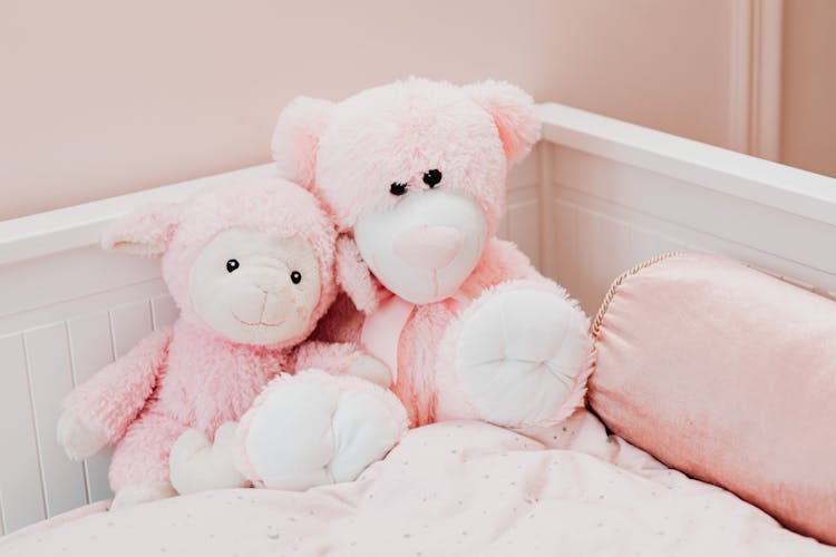 Pink Bear Plush Toy On White Bed