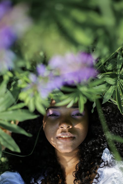 Woman With Purple Flower on Head