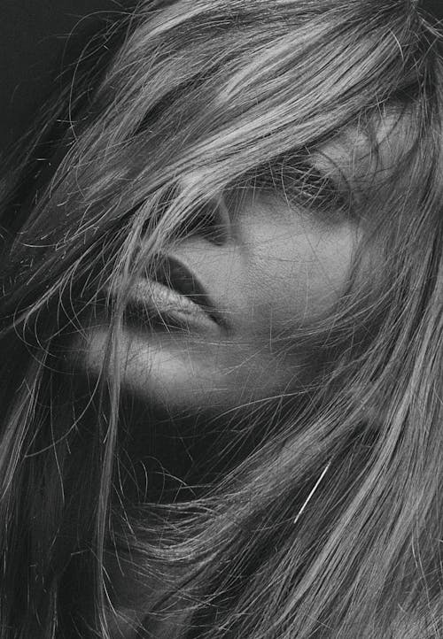 Grayscale Photo of Woman with Messy Hair