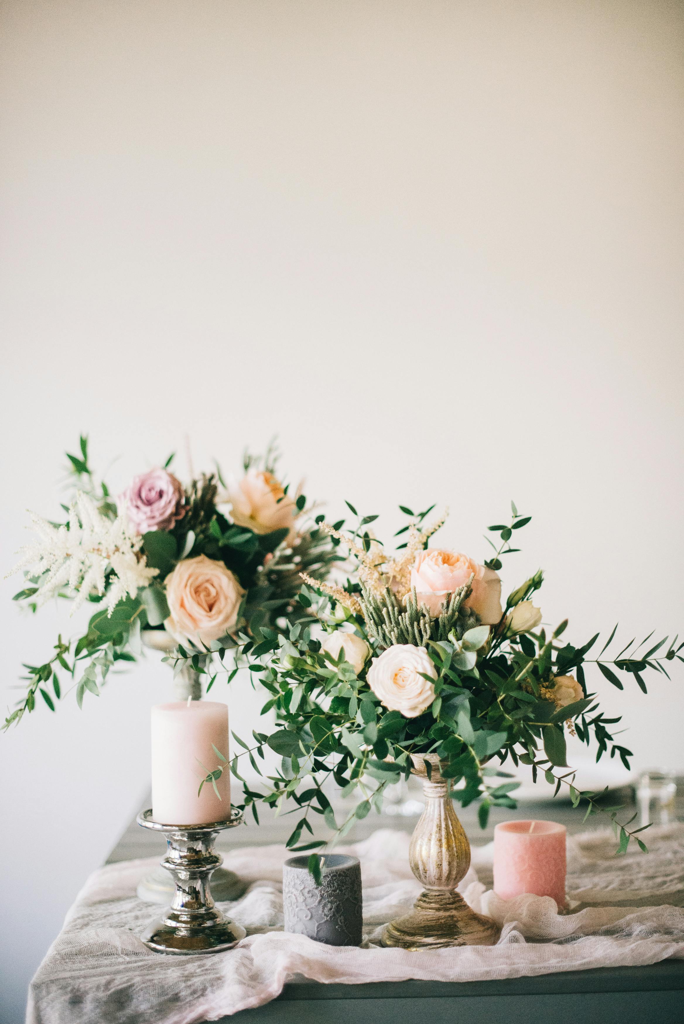 flowers and candles on a table