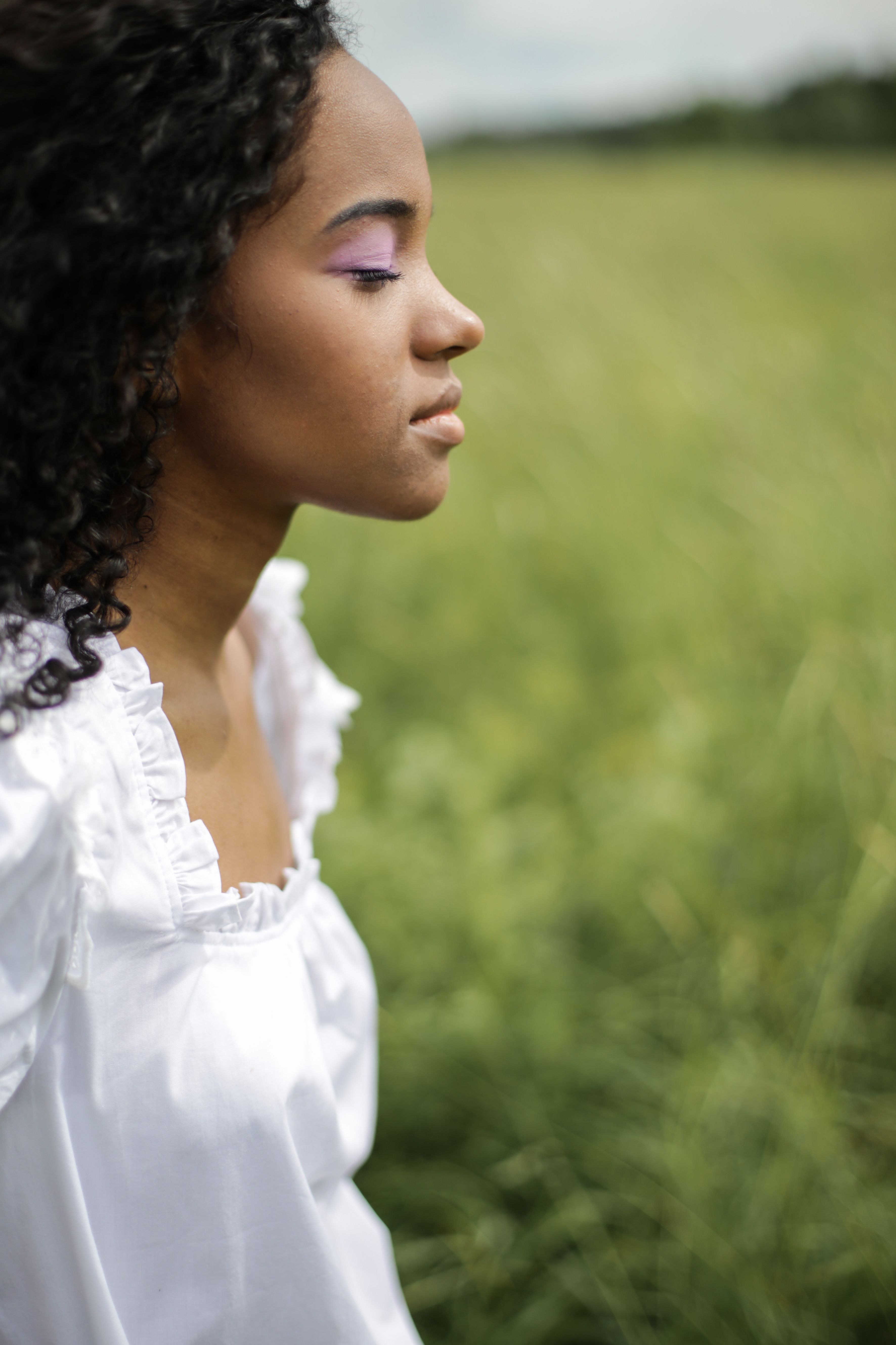 Woman in White Dress Standing on Green Grass Field · Free Stock Photo