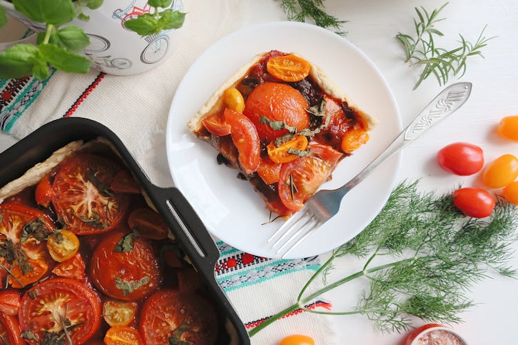 A Delicious Tomato Pie On White Plate