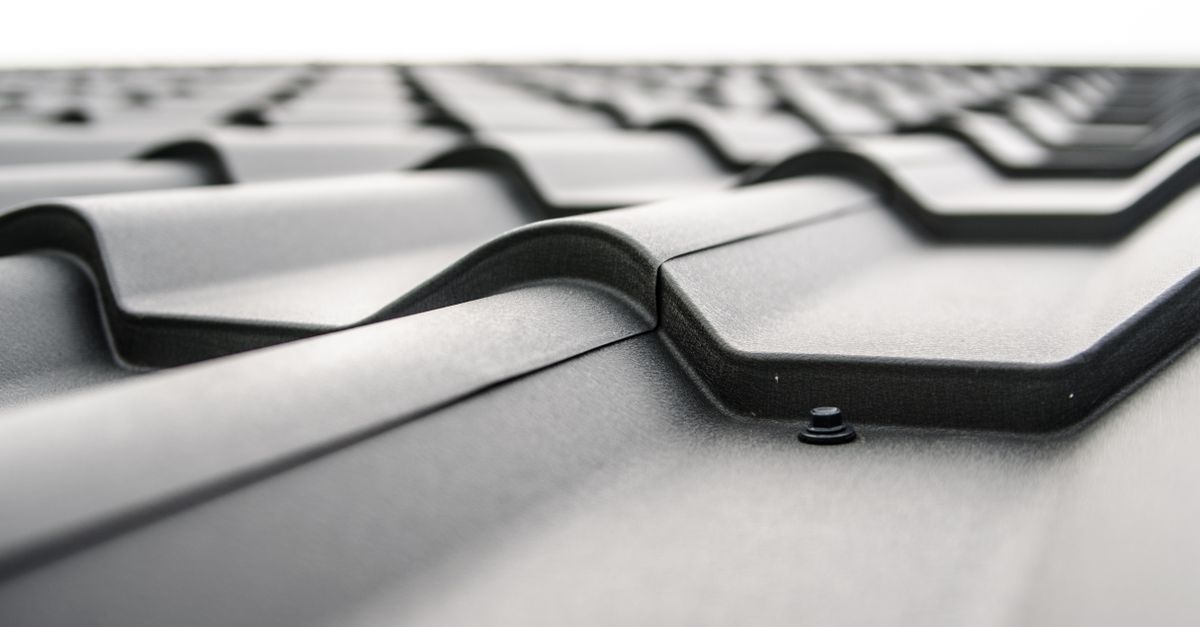 Photo by Pixabay Close-up view of a metal roof's wavy design showcasing rivets and structural detail.