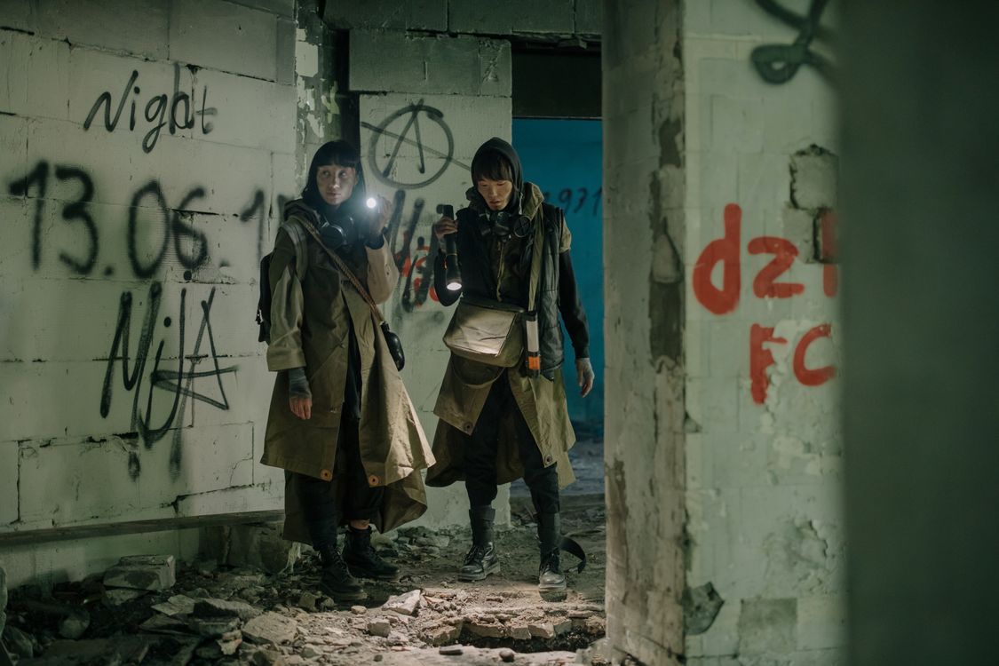 two people in abandoned building
