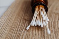 Close-up View of Cotton Buds in Bottle