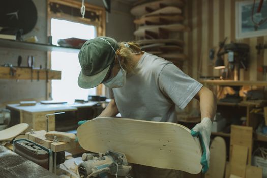 A Man Making a Skateboard