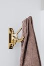 Gray Towel on Brass Door Lever