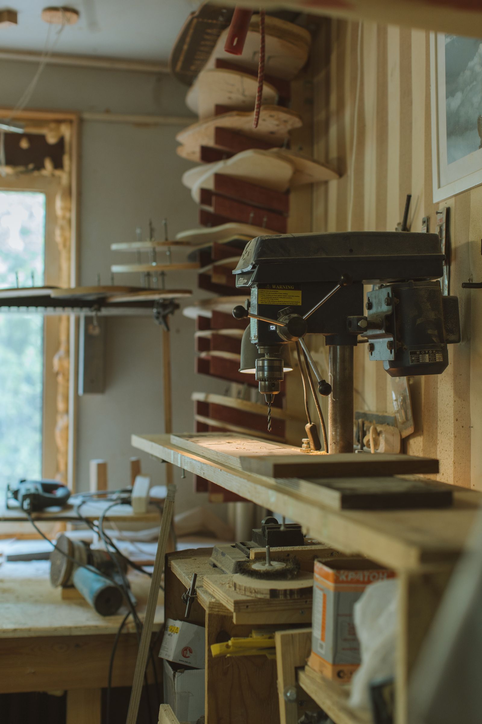 Organized workshop equipment prepared around a woodworking station