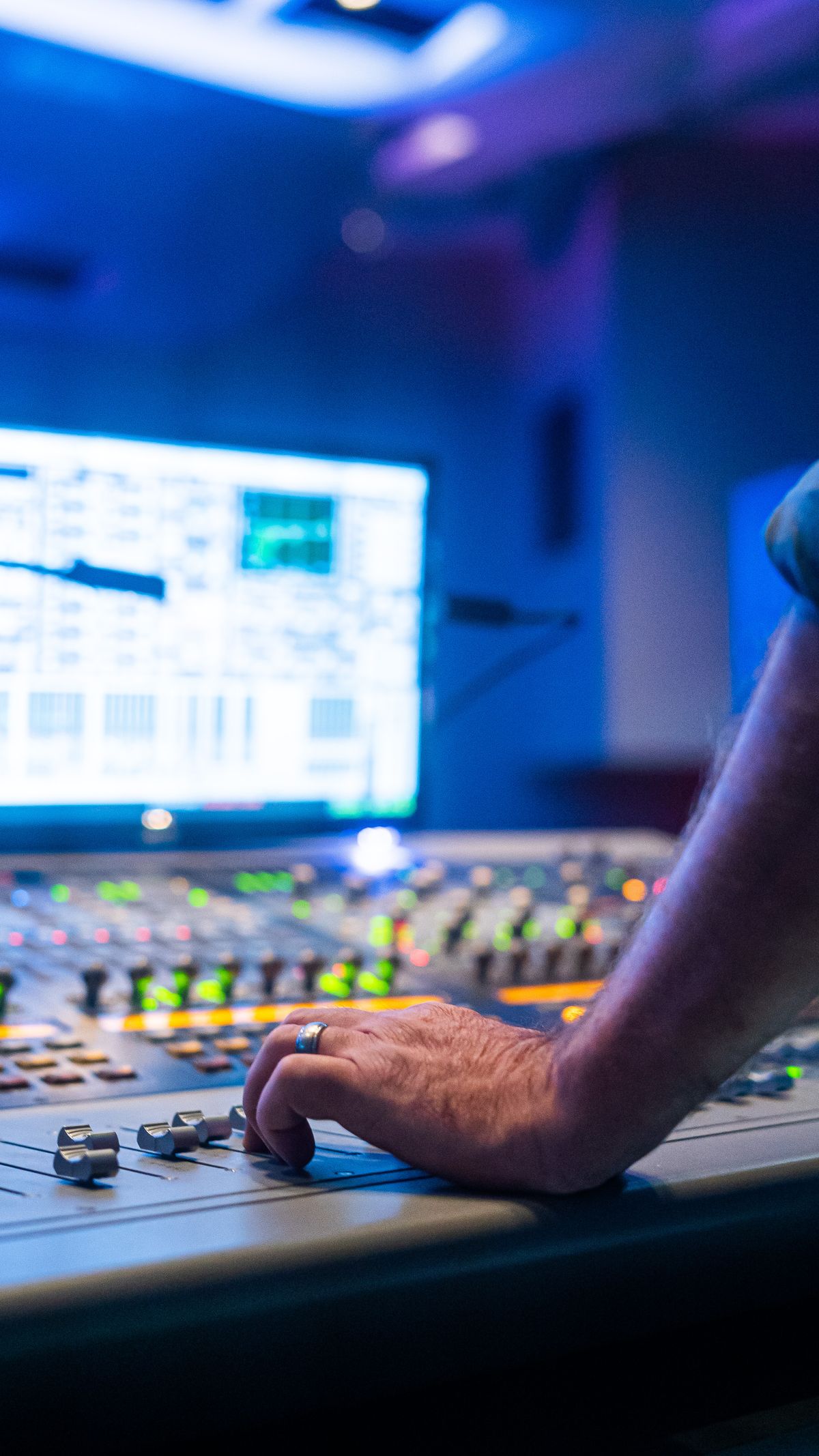 Audio engineer at mixing desk