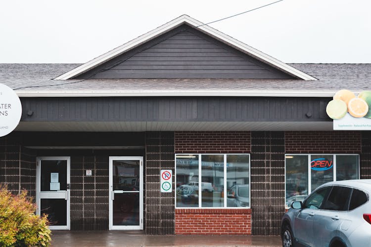 Exterior Of Modern Shop With Signs