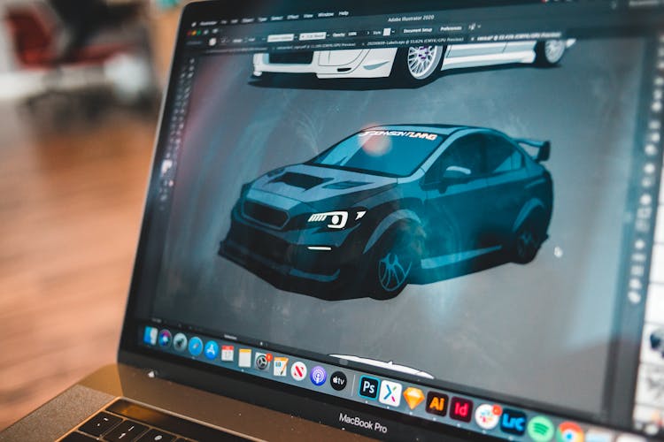 Modern Laptop With Sports Car Illustration On Screen