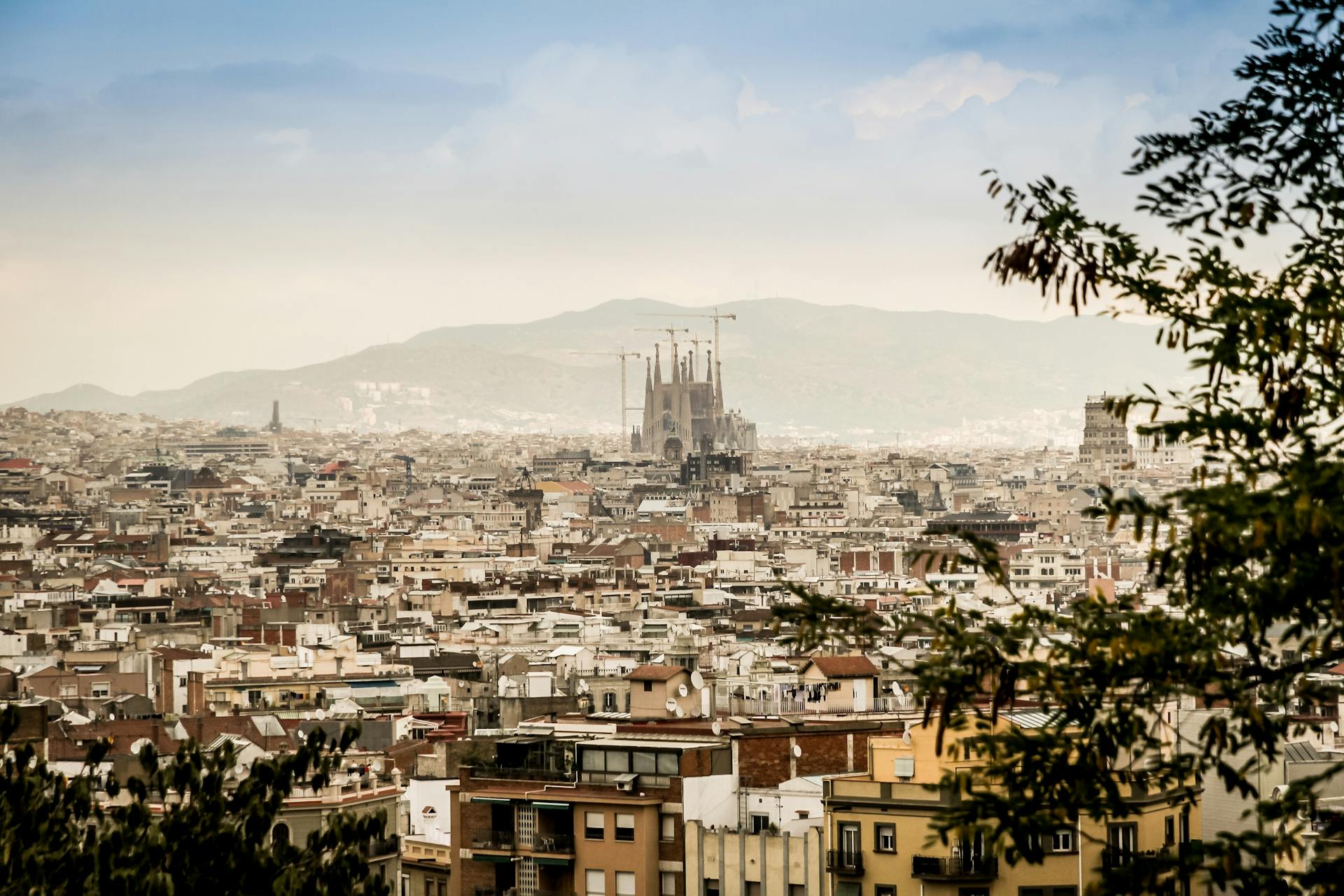 A picturesque view of Barcelona's cityscape with the iconic Sagrada Família in the background.