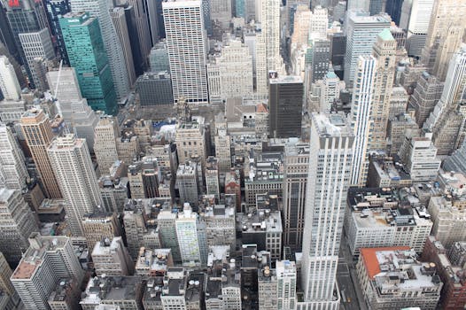Bird's eye view of urban skyline with iconic high-rise buildings in New York City.