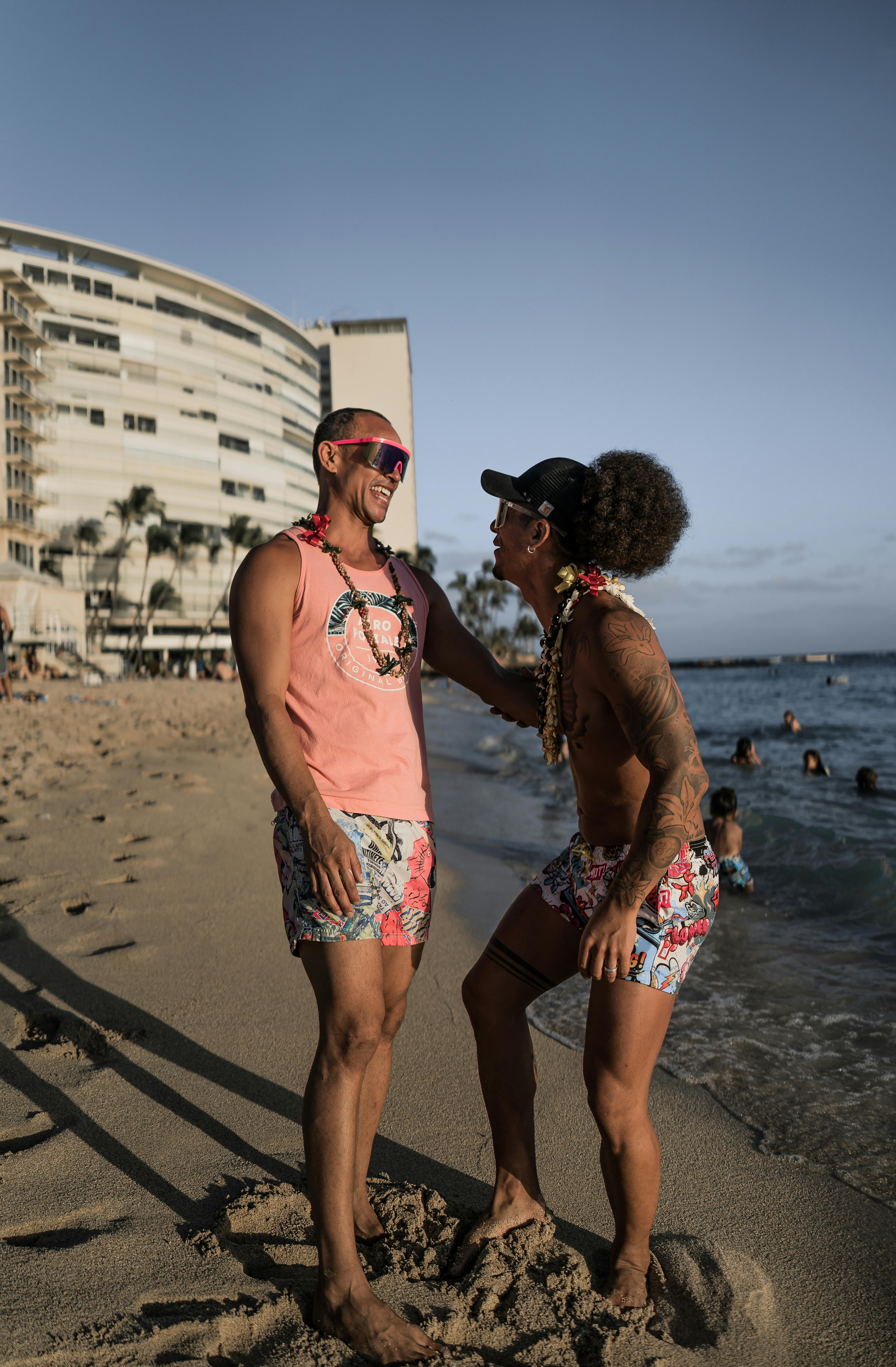 joyful ethnic couple on seaside