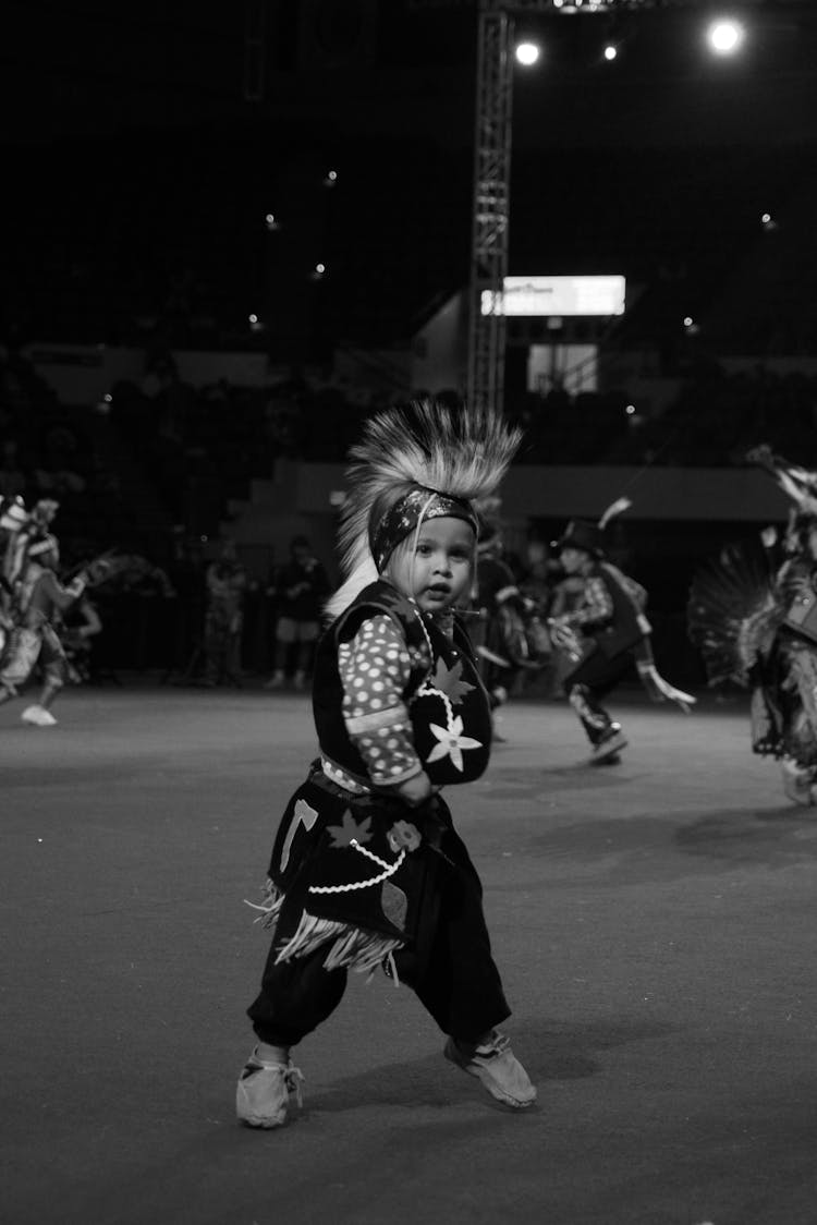 Artistic Kid In Traditional Costume Dancing On Street