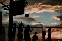 Silhouetted players under a dusk sky, photo by Amiel Joseph Labrador on Pexels