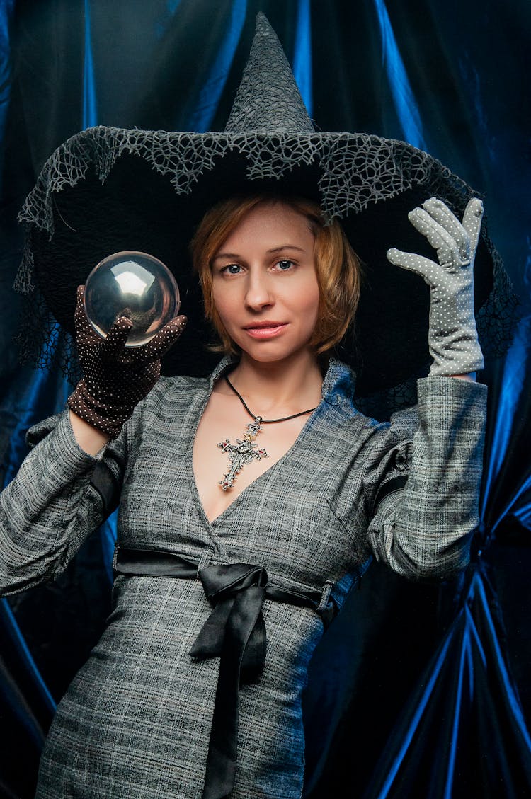 Young Woman Dressed Like Scaring Witch Standing With Crystal Ball