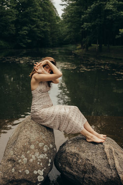 A Woman Sitting on Rock 