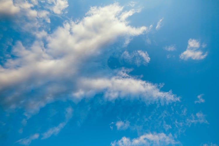 Light Fluffy Clouds On Blue Sky